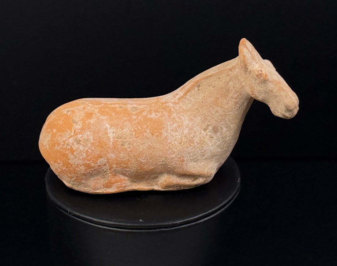 Chinese Tang Dynasty Terracotta Recumbent Horse: 4 1/4" by 2 1/8" by 1 1/2. Provenance: Ex. Private Illinois Collection. Acquired at Susanin?s Auctions, IL, April 2011