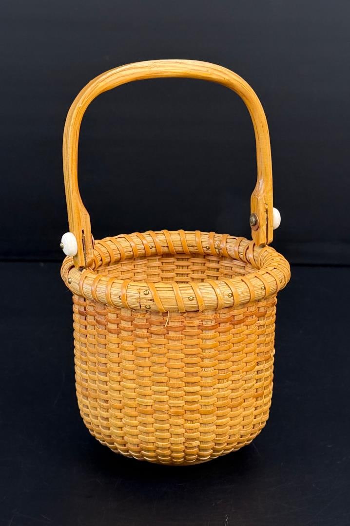 Paul Whitten Nantucket Lighthouse Basket: Signed as shown, dated 1983. 4 5/8" tall with handle collapsed, 4" diameter.