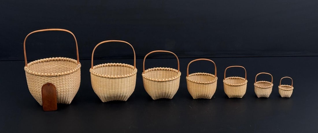 Nested Nantucket Graduated Basket Set: Signed JND 1993. Largest is 5 1/2" by 4 1/8" by 4".