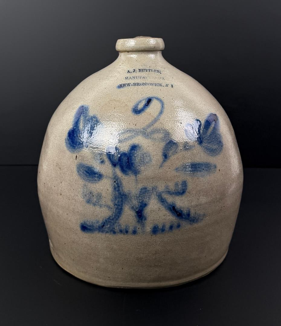 A.J. Buttler Salt Glaze 2 Gallon Stoneware Jug: Stump or Urn with flowers pattern. 10 1/2" tall, 10 3/8" diameter.