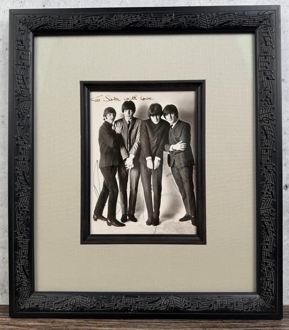 The Beatles Band Signed Photo: Outstanding photo, fully signed by all band members. Photo is 6" by 8". 14" by 16" framed. Photographer is Dezo Hoffmann. Provenance: The Estate of Sara Simkowitz. Photo was signed in person and inscr