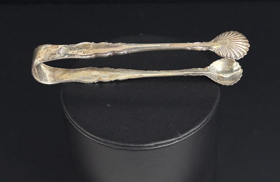 Reed & Barton Sterling Silver Sugar Tongs: 4 1/4" long. 31.35 grams.