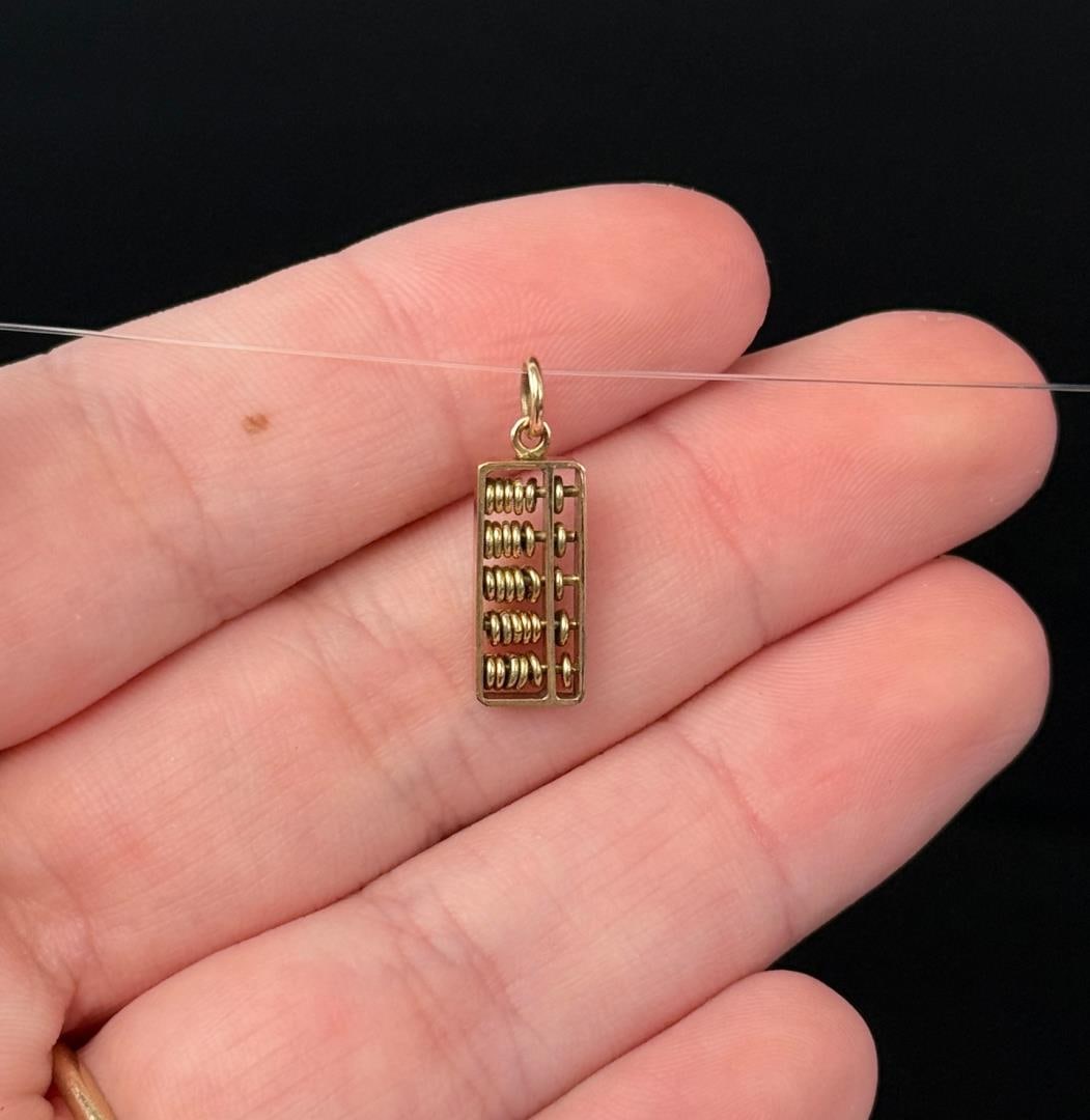 14k Gold Abacus Charm: 1.33 grams. 5/8" long.