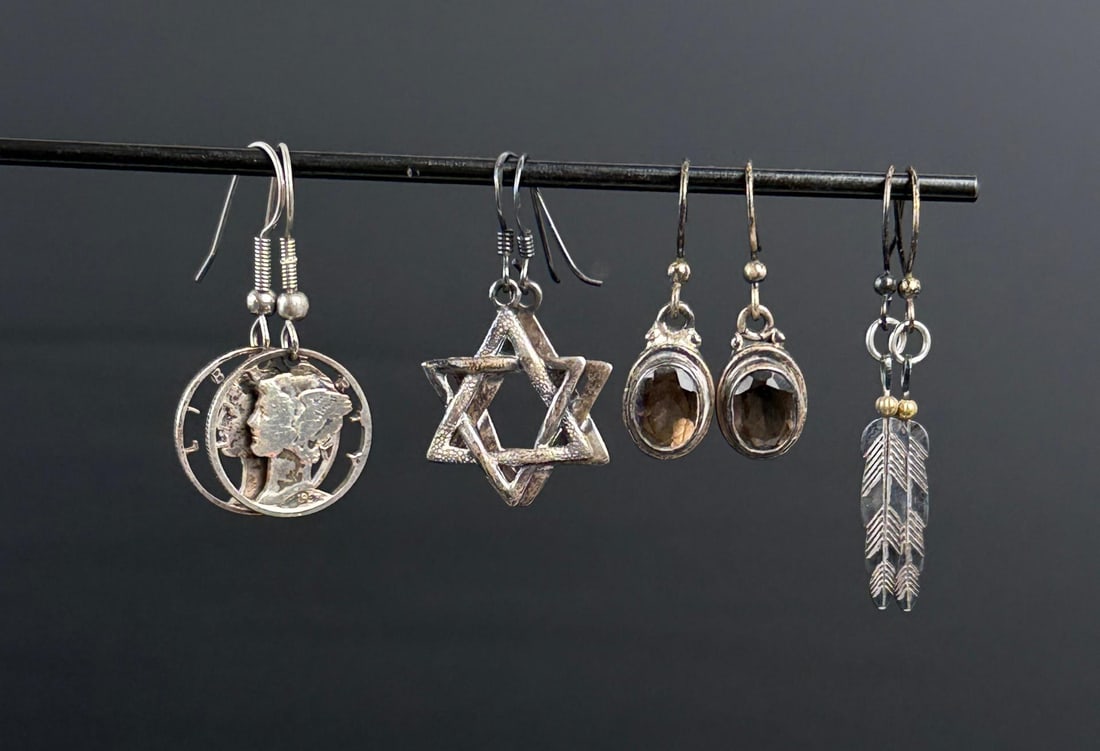 Collection of Sterling Silver Earrings: 14.19 grams. Largest is 7/8" long.