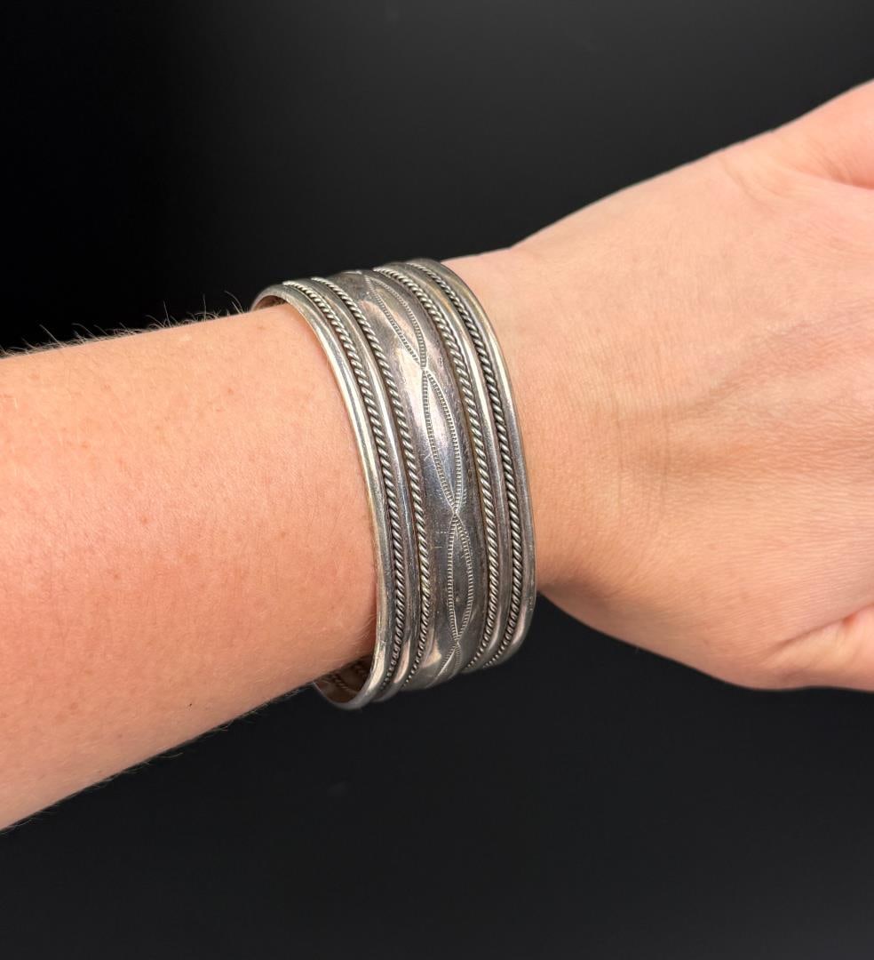 Nora Tahe Navajo Sterling Silver Cuff Bracelet: 48.55 grams. 6 1/4" inner circumference.