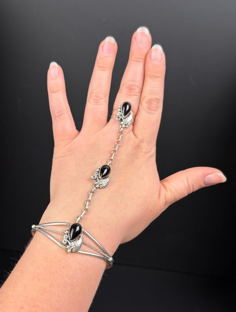 Navajo Sterling Silver Onyx Slave Bracelet: 19.69 grams.
