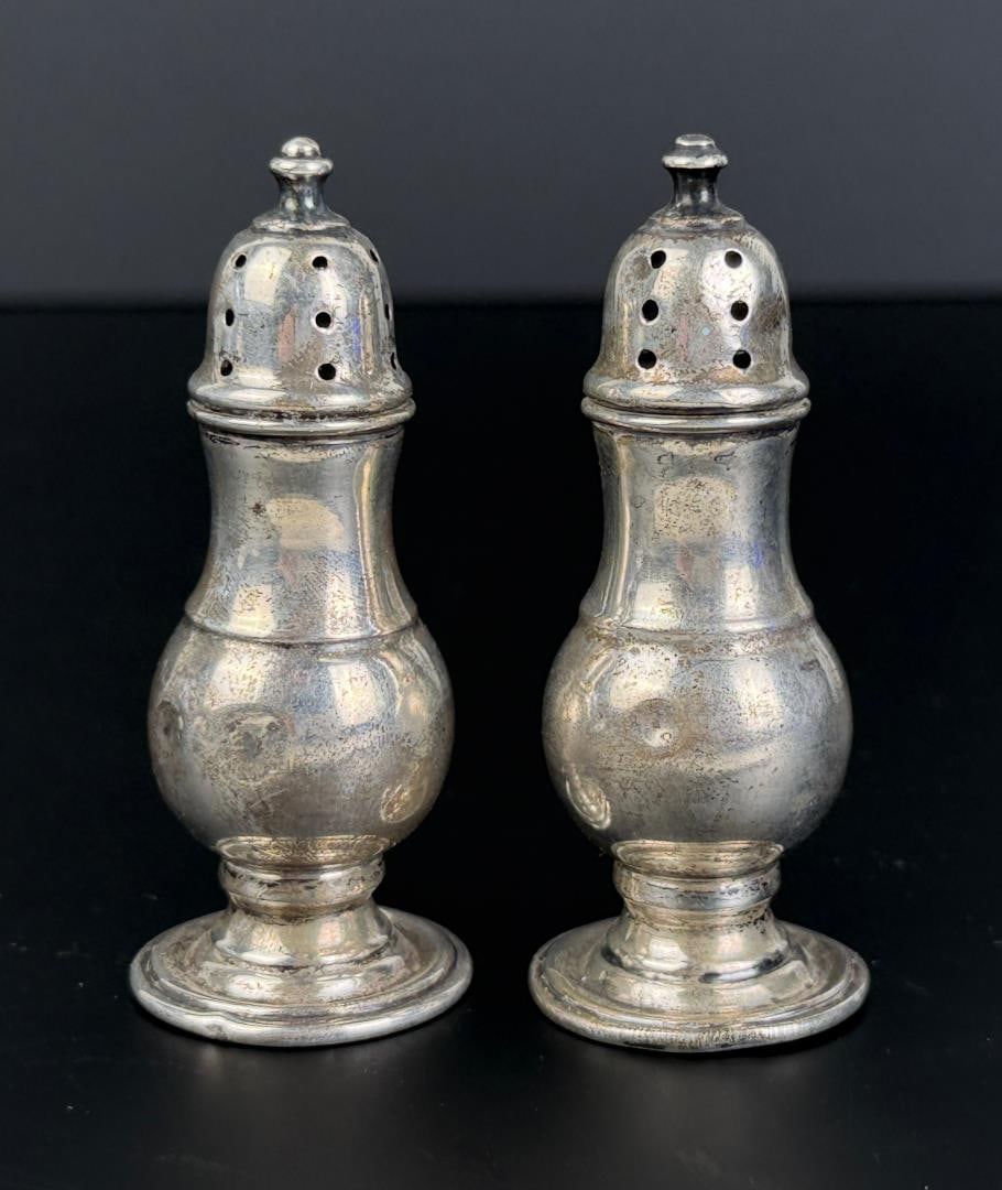Sterling Silver Salt and Pepper Shakers: 27.19 grams total. 2 7/8" by 1 1/8" by 1 1/8".