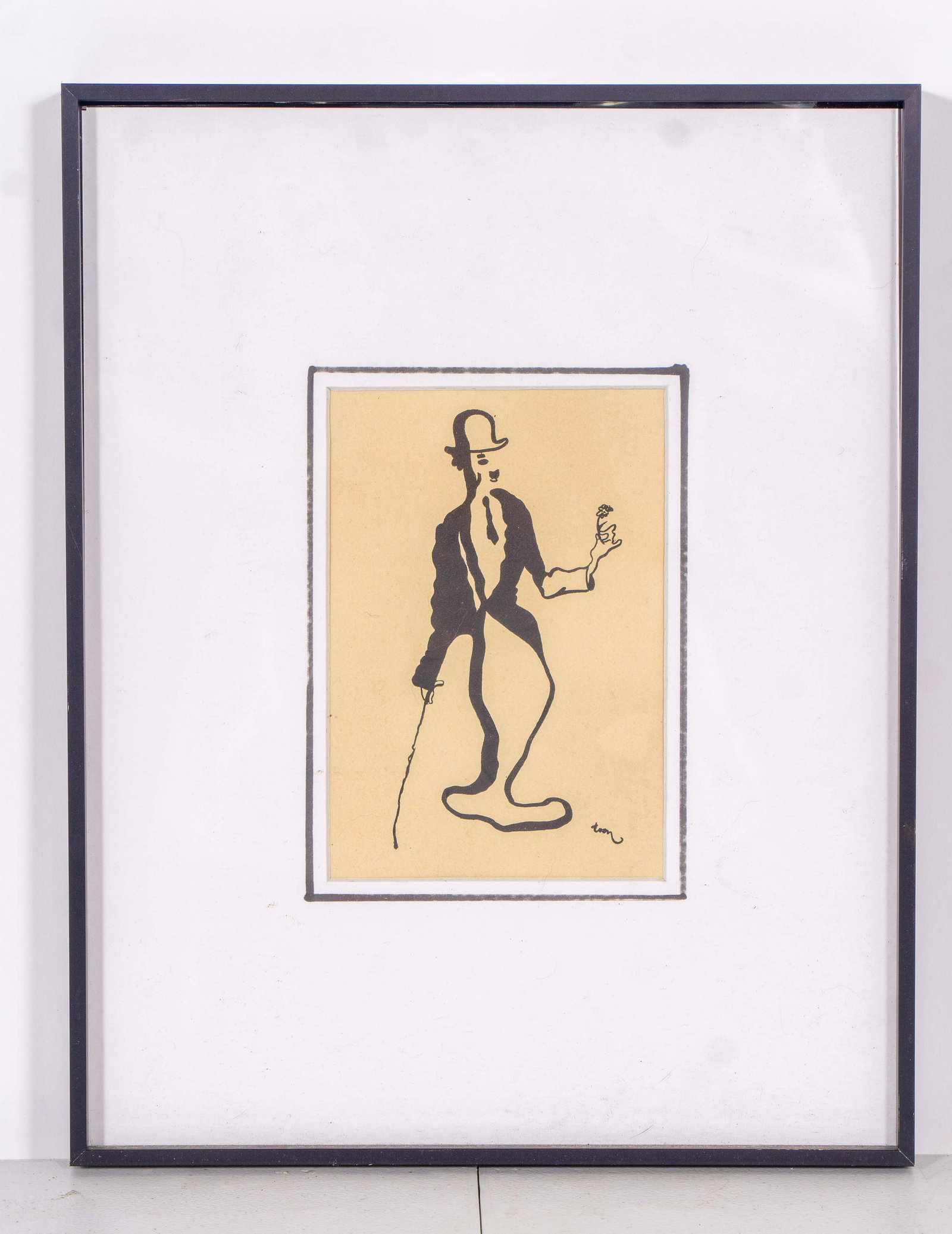 Vintage Mid-Century Illustration of Charlie Chaplin by: Vintage black and white illustration of Charlie Chaplin by Dutch performer and artist Toon Hermans, in white matting and black frame. Some minor spots to matting. Measures 12" x 15".