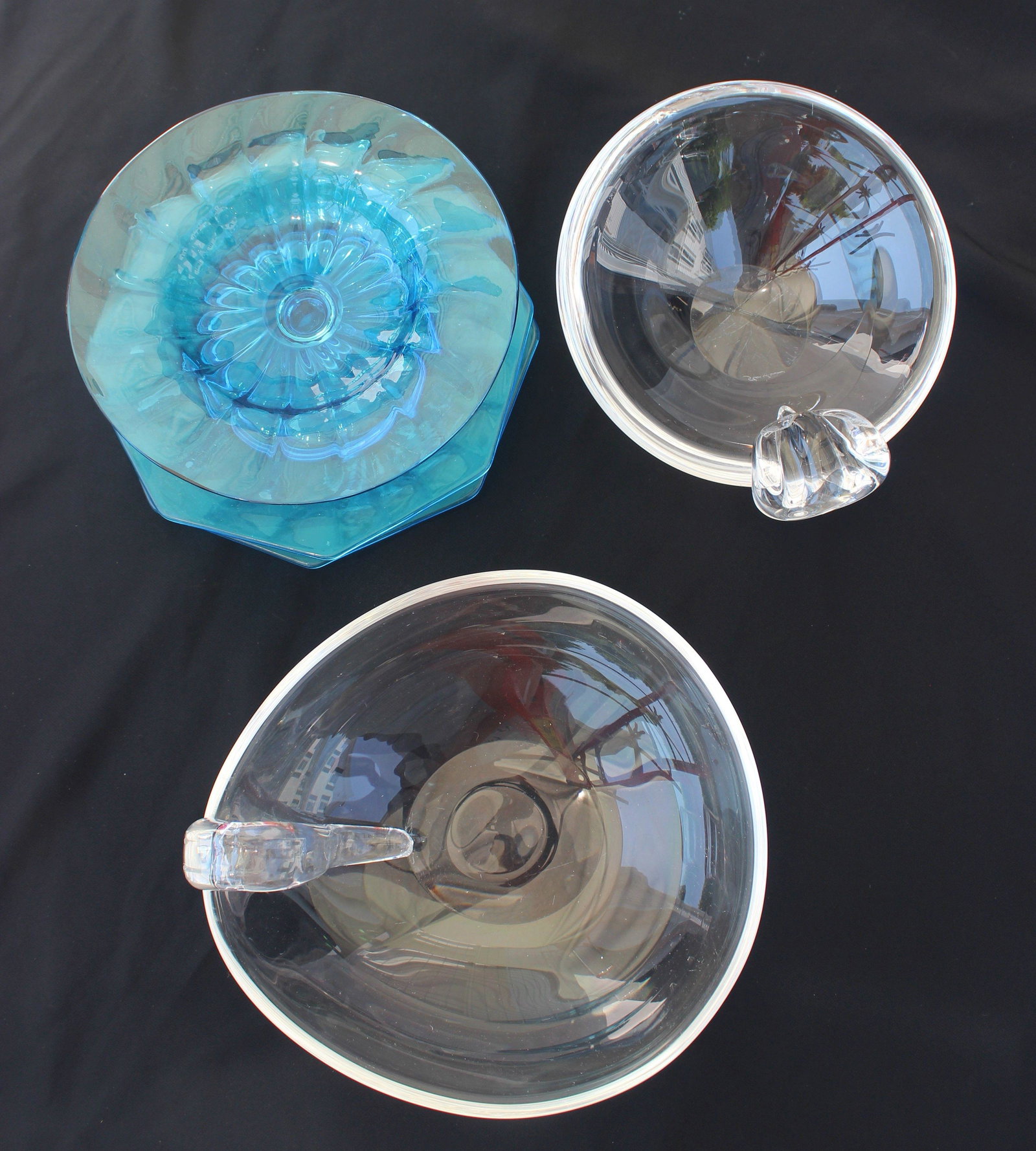 STEUEBEN GLASS LOT: Two glass Steuben dishes both are signed and are in good condition. size 6.5" & 8". The blue glass is unsigned may not be Steuben, the compote appears to have been grounded on the edge.