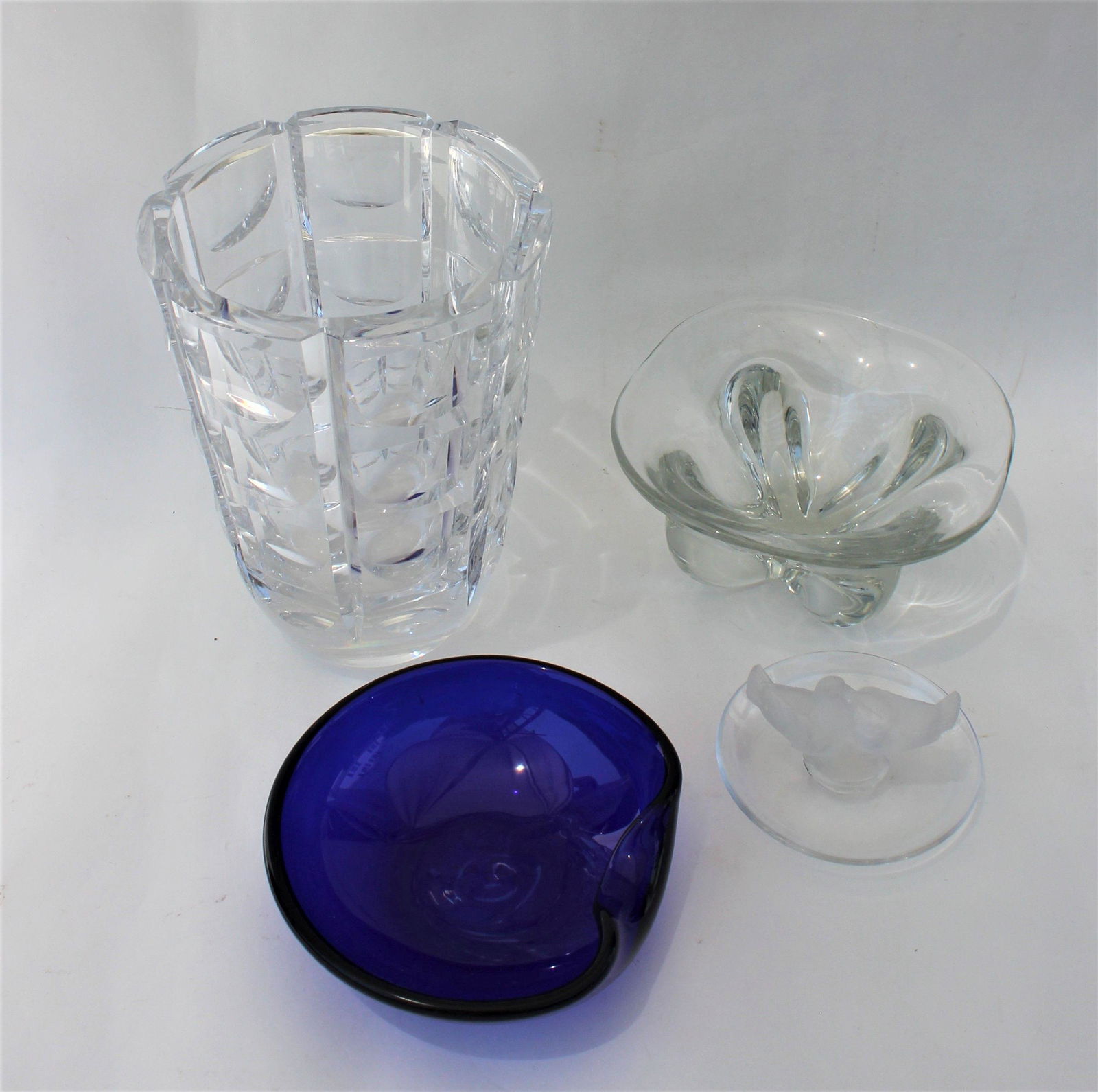 FOUR PIECE ART GLASS LOT: Elsa Peretti thumbprint cobalt blue bowl made for Tiffany signed 5.5", Orrefors glass vase 7.5", Lalique dish with birds 4", unmarked bowl 6"