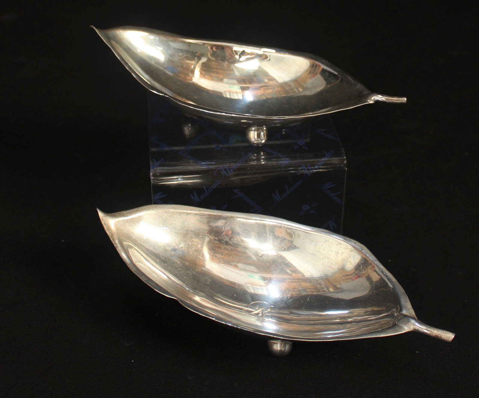 CARTIER STERLING SILVER LEAF DISH W/SIMILIAR DISH: These two silver dishes are identical except for the mark. 1st dish is monogrammed R and is marked Cartier handmade sterling "S" #10. The 2nd dish is marked Shreve, Crump & Low Co. handmade Sciarrotta