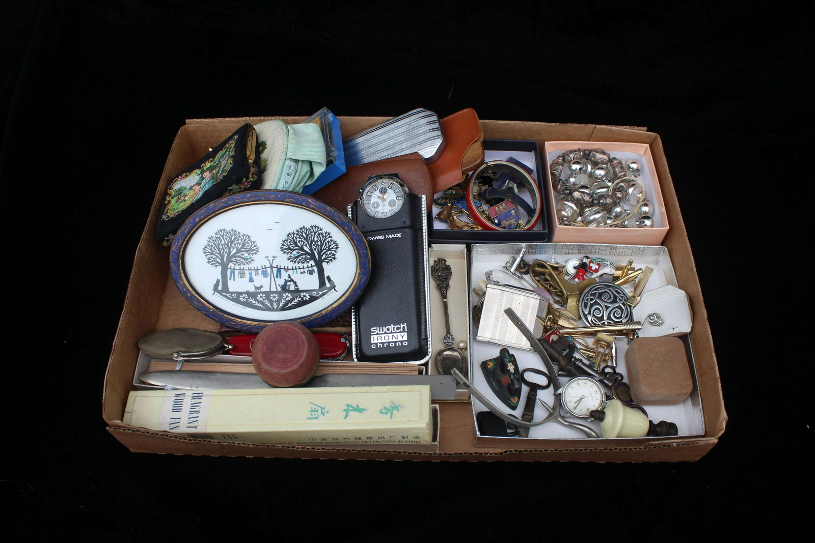 TRAY LOT MISCELLANEOUS ITEMS: This lot contains the contents of a drawer with various items including a unused Swatch Irony Chrono watch, keys, costume jewelry etcetera.