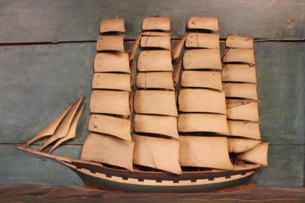 FOLK ART SHIP DIARAMA w/wooden sails: 19th century folksy wooden ship diorama from the New Hampshire coastal area, great paint on this piece untouched condition. Size 21" x 32" Condition one of the sails is broken, some of the rigging is 