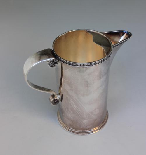 BUCCELLATI STERLING SILVER PITCHER: Buccellati silver pitcher is marked Buccellatti, Sterling, Italy, 925 & reg. numbers. Size 6.25" H x 3.5" D. 19 troy ounces. Condition overall very good except by a small area under the top of the han