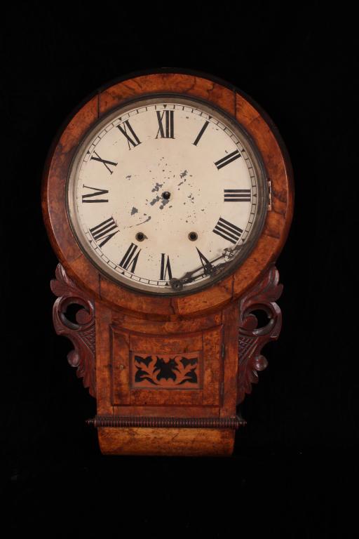 NEW HAVEN SCHOOL HOUSE CLOCK: The case is burled walnut, the clock is marked New Haven Clock Company. Size 12" dial, 27" L x16" W Condition running but hands are not attached.