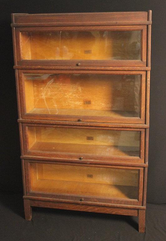 Set of Oak Barrister Bookcases: Condition is consistent with age and use, some repair to the base, and back foot. 1 of the glasses is cracked, Size 58"H, 11" D, 34" W.