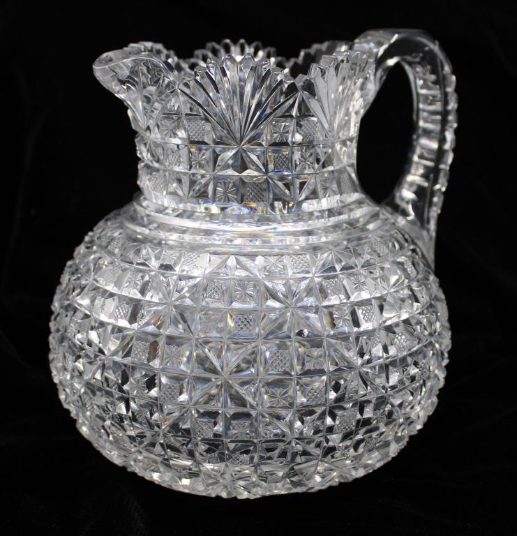 American Brilliant Cut Glass Water Pitcher: Wonderful cut glass bulbous water pitcher from the American brilliant period, does show some nicks around the bottom half of the pitcher consistence with use. Size 7" x 7"