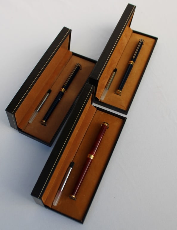S. T. Dupont Fountain Pens: (2) blue (1) Red all with boxes, 18k nibs, Note very small worn spot on one of the blue pens.