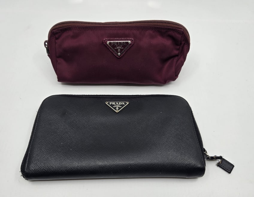 Prada Black Wallet & Accessories Bag: Prada Black Leather Wallet with authenticity card. size 7.25" x 4". Good condition. Prada burgundy nylon accessories bag 7" x 3".