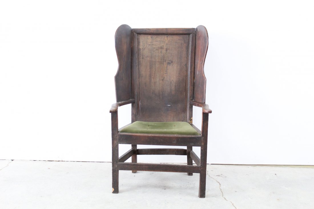 Wingback Green Velvet Chair: Wingback green velvet chair, wood pegged construction, velvet cushions. This chair is in good, missing piece of inner corner, missing small piece off the foot.