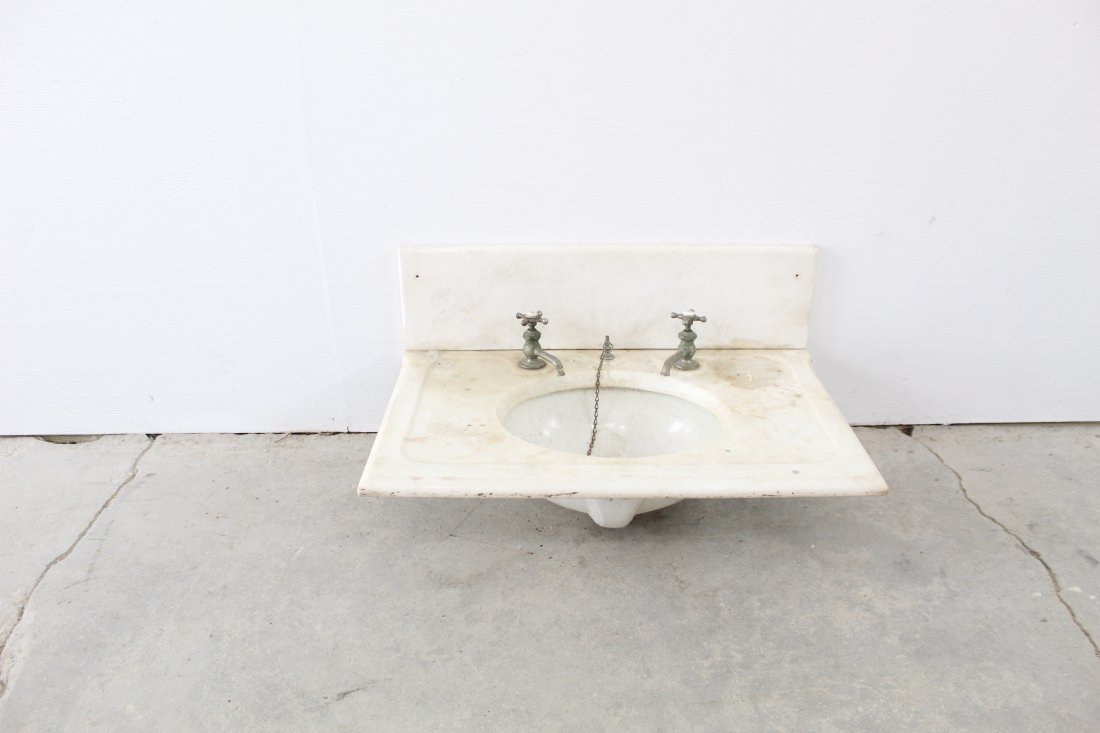 Marble Sink & Faucet: Great piece of architectural is this sink, all marble surround with backsplash, even has the original hot and cold faucets. The backsplash is a separate piece but part of the set.Condition: very good.