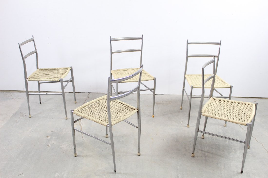 Set of 5 Modern Chrome Chairs in Manner of Gio Ponti: Set of 5 Modern Chrome Chairs in Manner of Gio Ponti, they can be used indoors or out. The metal is in great condition, minor surface wear with white woven vinyl seats. Two of the chairs has a break t