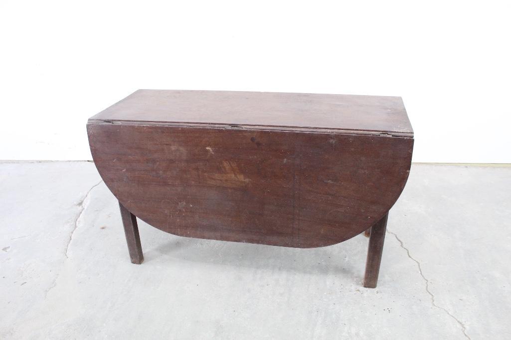 Antique Wooden Drop Leaf Refractory Table: Antique Wooden Drop Leaf Refractory Table. The dimensions of the table with the leaves folded down are 28in x 48in x 19in. The original owner said they got this overseas in England and was a refractor