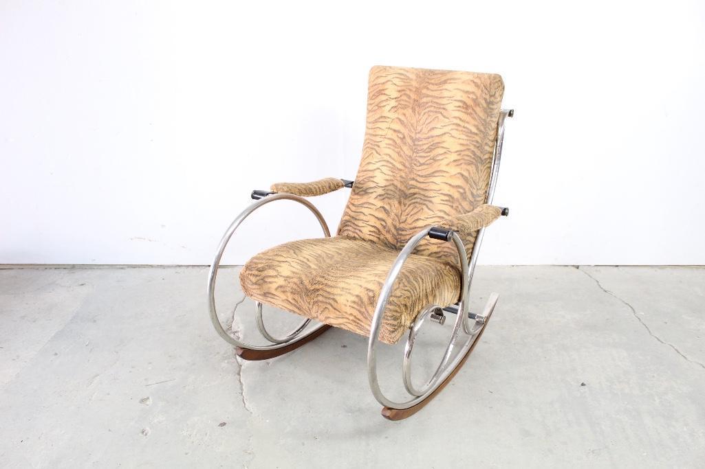 Tiger Print Fabric Chrome Rocker Chair: Tiger print fabric chrome rocker. Be the next tiger king in this cool chrome rocker. This funky chair will allow you to rock and relax while staying stylish. This chair was made by Woodard. The dimens