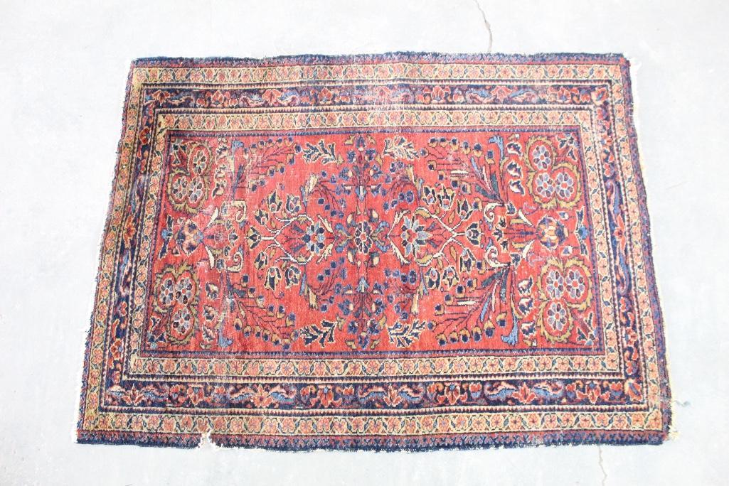 Antique Oreintal Rug with Red & Blue, Worn, 41in x 58in: Large scale Persian rug with a red background and a blue, yellow and white floral and bird like pattern mirroring each other in the center. It has a darker blue border featuring similar floral pattern