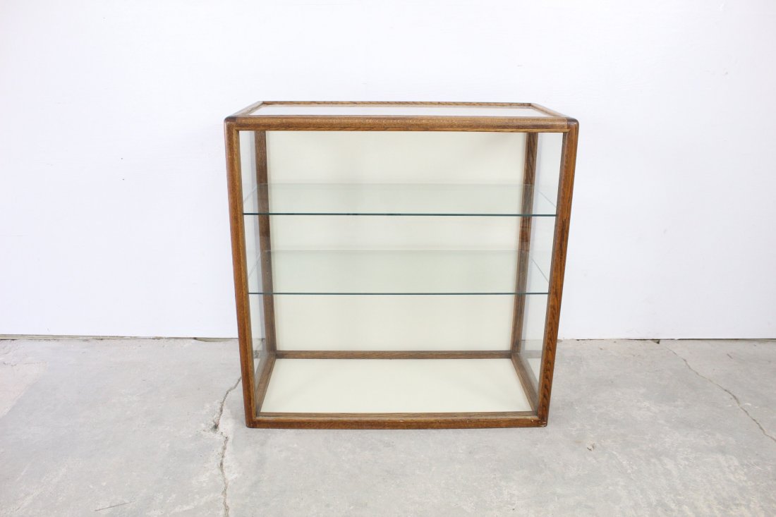 Wood and Glass Display Case: Wood and glass display case that adds a simple look and would be a perfect home for all of your treasures. The dimensions of the display case are 36in x 35in x 17in. Condition: This display case is in