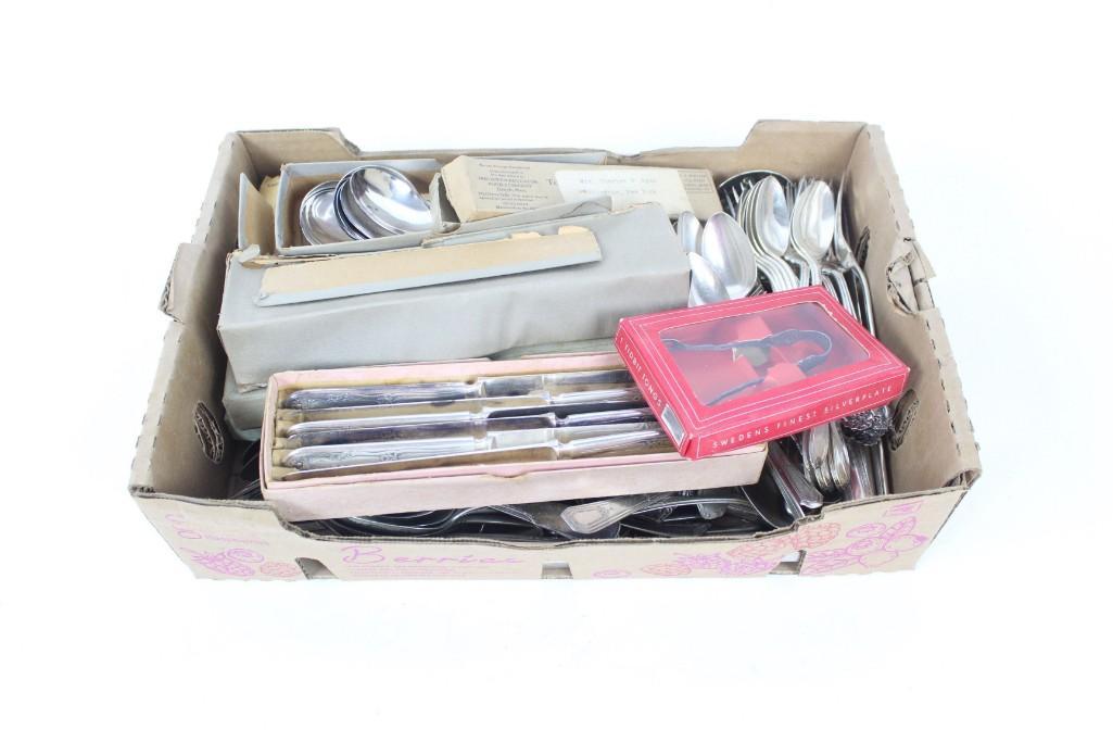 Estate Lot of Silverware,Silverplate Utensils in Boxes: Lot of miscellaneous silverware. This lot includes lots of fun and interesting items including nut picks, serving spoons, a carving knife and fork, and commemorative spoons from the 1939 New York Worl