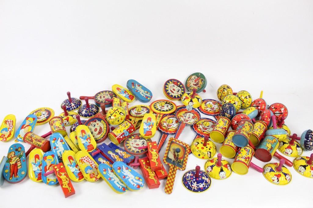 Huge Lot of Vintage Tin Noisemakers Party Favors: Lot of antique tin noisemakers with clowns. These antique noisemakers evoke trips to the circus to see clowns perform their antics. The dimensions are 8.5in x 4.5in. Condition: they are in fair cond