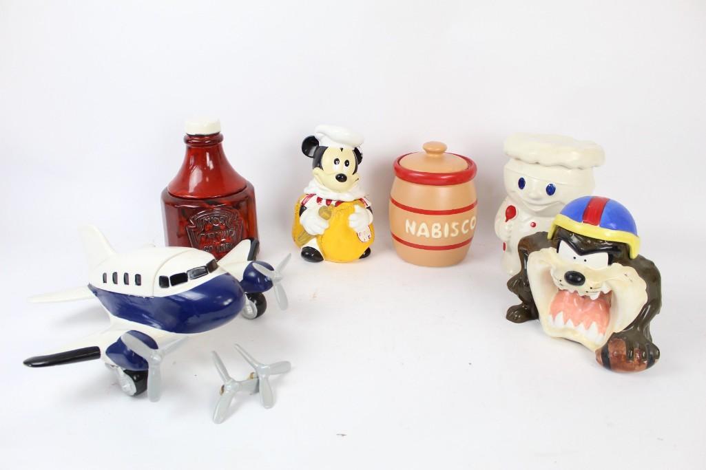 Lot of Six Cookie Jars (Lot 8 of 9): Lot of six cookie jars (lot 8 of 9). This lot has an assortment of cute Disney characters and objects. They are sure to delight you whenever you reach for a cookie. The dimensions range from 7in x 14.