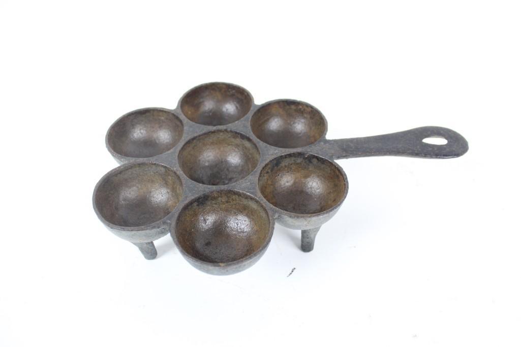 19th Cent Cast Iron Aebleskiver Popover Pan,Spider Legs: 19th Cent Cast Iron Aebleskiver Popover Pan,Spider Legs. This pan has seven circular indentations for making aebleskiver, a traditional Danish snack like a spherical pancake. This pan has three legs a