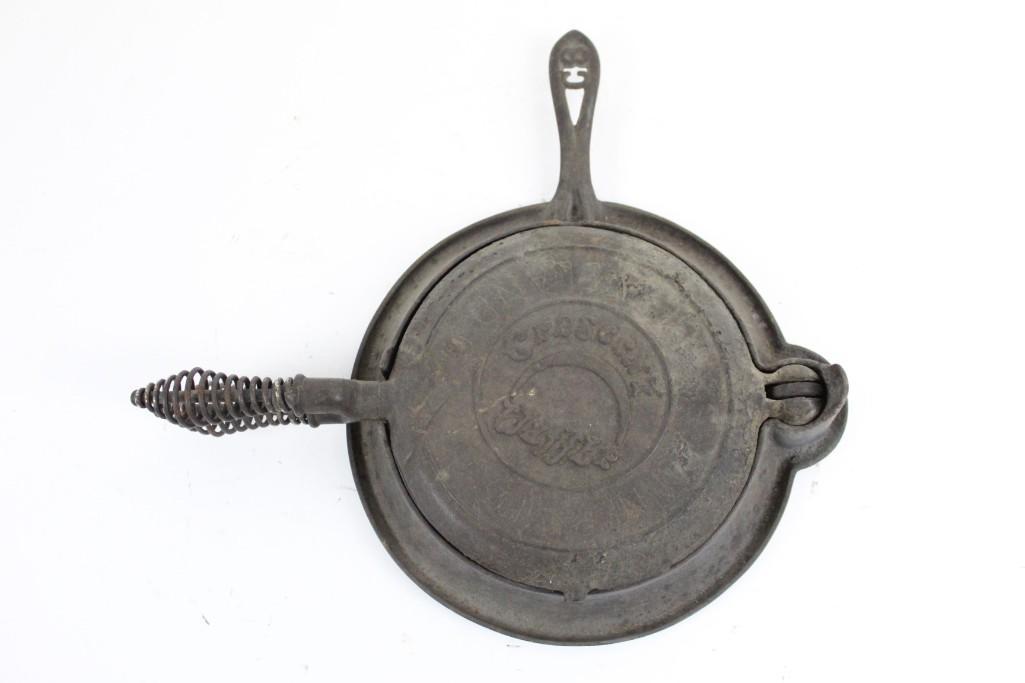 Cast Iron 'Crescent' Waffle Iron: Cast Iron 'Crescent' Waffle Iron. This waffle iron features coiled handles, a 360Ëš ball joint, and is marked "C8" and "No. 8," as well as "Crescent Waffles." The dimensions are 2.5 in x 14.25 in x