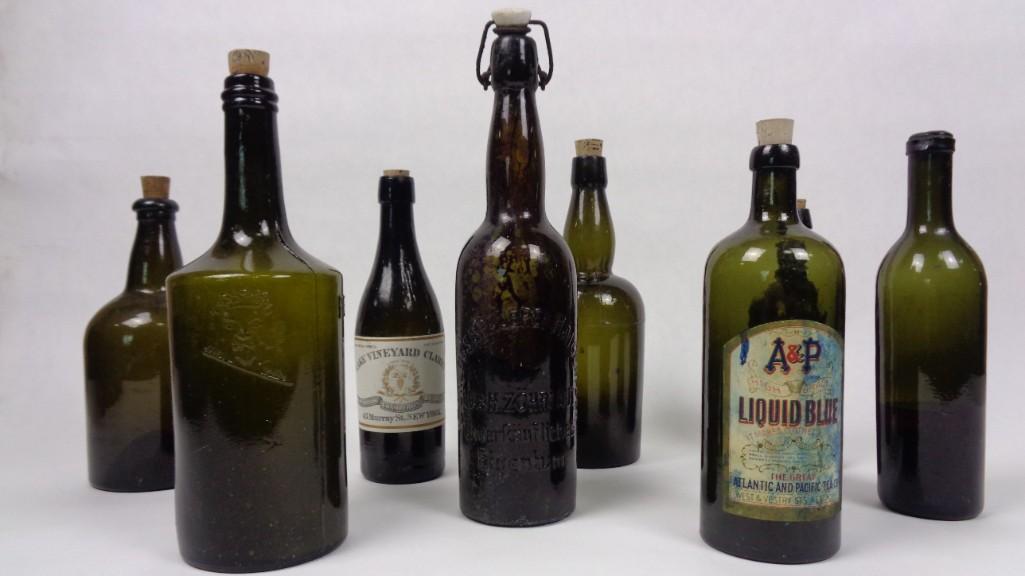 Lot of 8 Antique Dark Green Bottles,Olive,Paper Labels: Lot of 8 antique dark green bottles with corks and labels. Each bottle in this interesting lot has a cork or stopper and two of them still have labels. One of the labels advertises "A & P Liquid Blue 