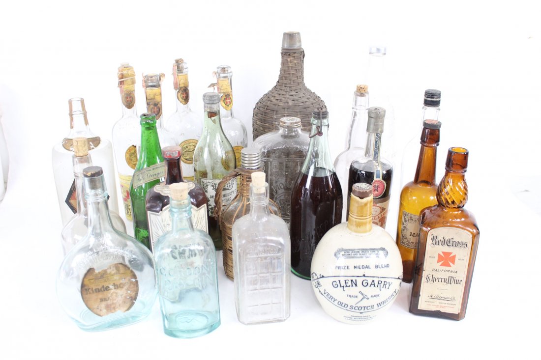 Lot of 28 Antique Glass Liquor Bottles,Whiskey,Pre-Pro: Assorted lot of antique glass and ceramic liquor bottles. This unique lot of glass and ceramic liquor bottles boasts that all but 2 bottles have their corks and 3 of them still have liquid inside. The