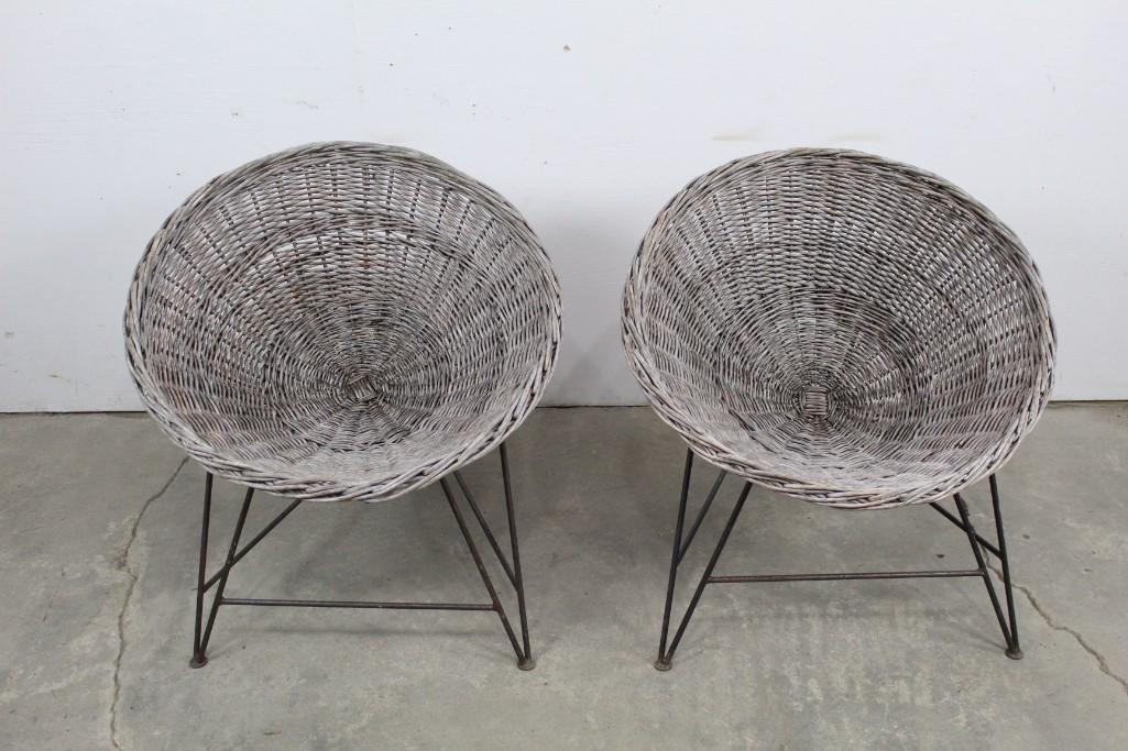 Mid Century Modern Pair of Iron & Rattan Saucer Chairs: Mid Century Modern Pair of Iron & Rattan Saucer Chairs. Made very much in the manner of Roberto Mango. Like sitting in a big basket, these chairs are held stury by a iron frame w/ three legs. Sit down