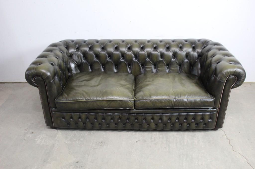 Chesterfield Tufted Leather Sofa, Green, Patina: Chesterfield Leather Sofa, Olive Green. The cushions are tufted. The sofa is a two seater, perfect for getting cozy or stretching out. The seats are deep, and the arms are wide. It invites you to nest