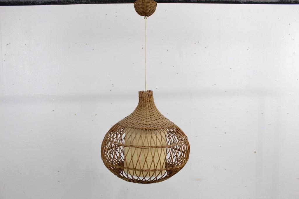 Mid-century Modern Wicker Hanging Light Fixture: Mid-century Modern Wicker Hanging Light Fixture featuring a woven circular design. This piece would look great in an enclosed porch or bar setting. The dimensions are 25 in h x 14 in w. Condition is g