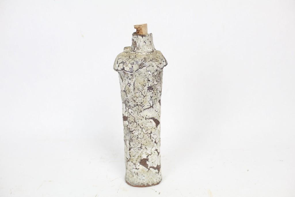 Primitive Signed Handmade Terra Cotta Bottle w/ Cork: Primitive signed handmade terra cotta bottle with cork. This white glazed terra cotta bottle has an interesting cracked glazed effect. It is signed on the bottom with "4.81 HELLER." The dimensions are