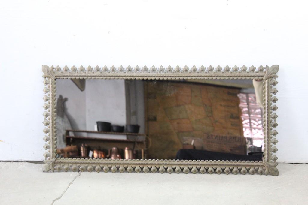 Antique Cast Iron 4-Foot Long Mirror with Leaf Pattern: Antique Steel Framed Mirror with Leaf Pattern. Back is wired for hanging. Would look stunning in an entryway or over a fireplace. Amazing bronzed iron surround. Dimensions are 46in h x 18in w. Conditi
