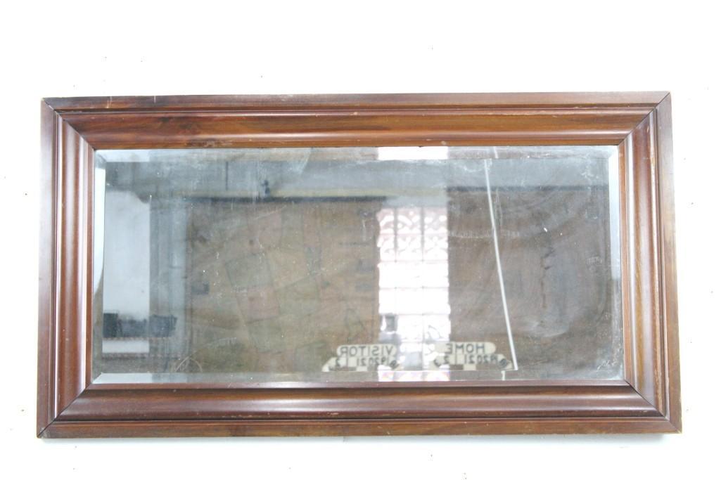 Antique Mahogany Beveled 4-foot Long Mirror: Antique mirror with beveled edge in solid wood frame, with wire on back across long dimension to be hung in a wide horizontal orientation. (Though this could be easily changed to make it a long vertic