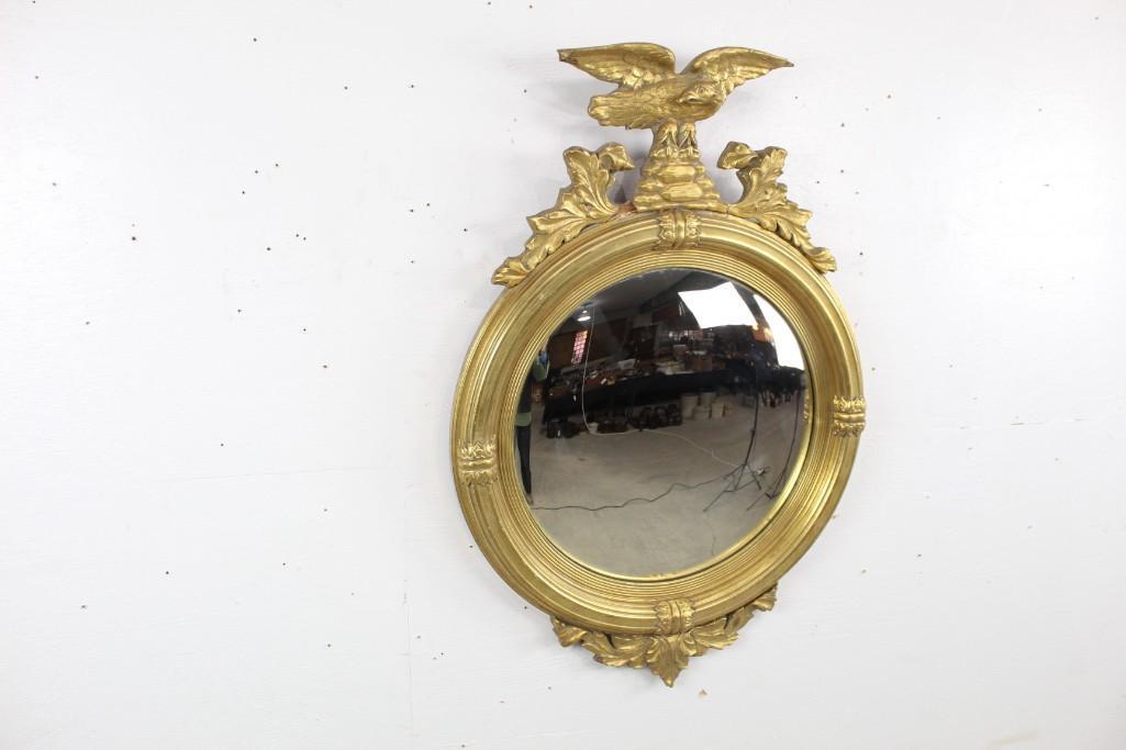 Antique Carved Gold Gilt Convex Federal Eagle Mirror: Antique Carved Convex Federal Eagle Mirror in Gold Gilt. This mirror is a great example of classic American decor. The dimensions are 35 in h x 24 in w. Condition is fair, with slight damage on the up