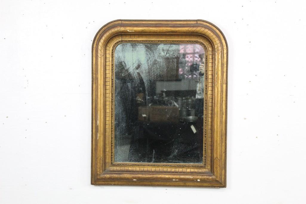 Antique Gold Gilt Arch Corner Mirror: Antique Gold Gilt Arch Corner Mirror. Beautiful frame with unique linear carvings, beaded edge, and original wooden back. The mirror has a warm and enchanting patina. Hang this mirror in your room wit