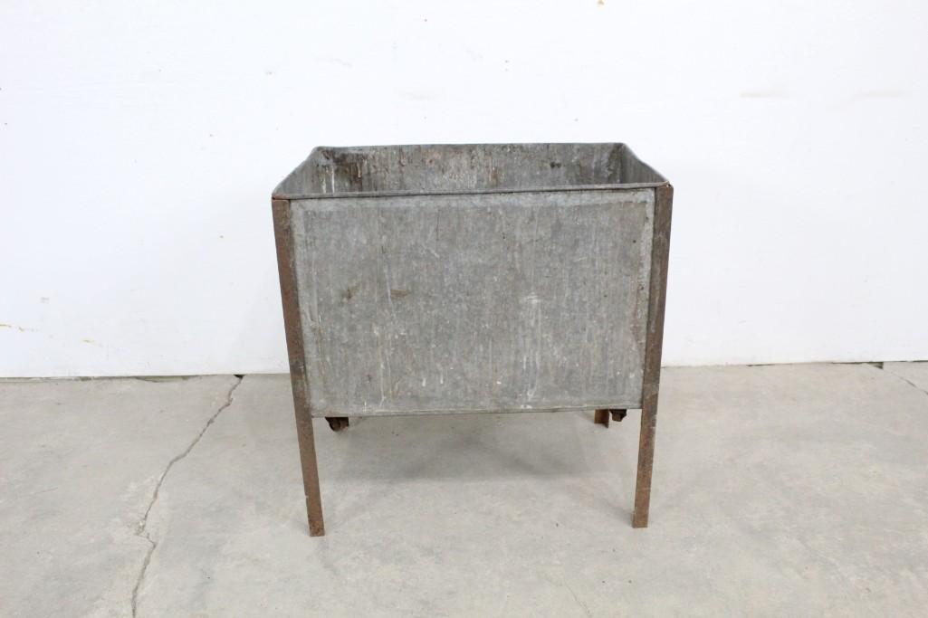 Antique Galvanized Industrial Factory Storage Bin Box: Antique Galvanized Industrial Factory Storage Bin Box. Bin stands on legs, but has wheels attached to bottom of tub. Useful for a workspace. Dimensions are 23in h x 22.5in w x 15in d. Condition is fai