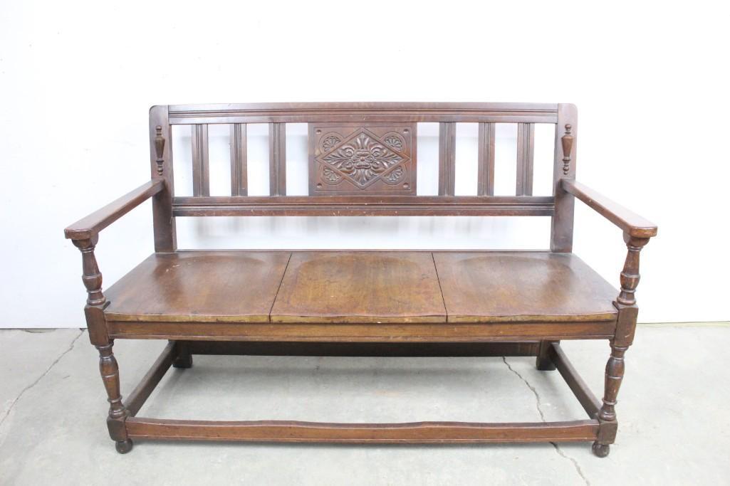 Antique Carved Back Bench by Plymouth Desk Co NY: Plymouth ornate carved wooden couch with removable blue cushion. This lovely wooden couch has beautiful ornate carved details. It has a blue velvet cushion which can be removed. There is a tiny plaque