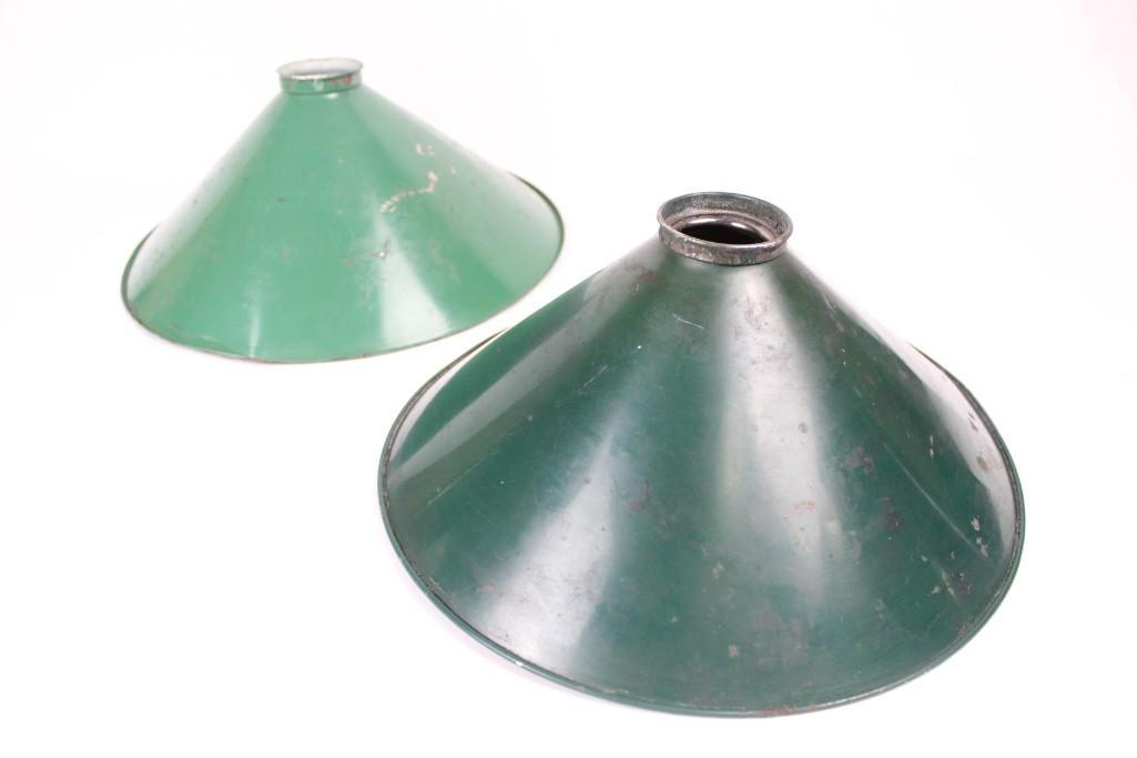Pair of Green Metal Mirrored Industrial Lamp shades: Pair of Green Metal Mirrored Industrial Lamp shades. One lampshade features a darker shade of green than the other. Mirrrored glass undersides. The dimensions are 5.5in h, 11.75in w, and 11.75in d. Th