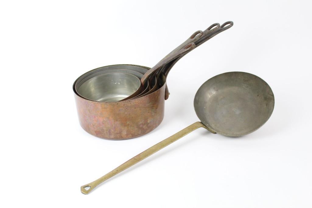 Set of Hammered Naour Copper Skillet & 4 Copper Pots: Set of Hammered Naour Copper Skillet & 4 Copper Pots. The small copper skillet is hammered, has a long handle, and is stamped "Naour." From the smallest to the largest, each copper pot fits nicely int