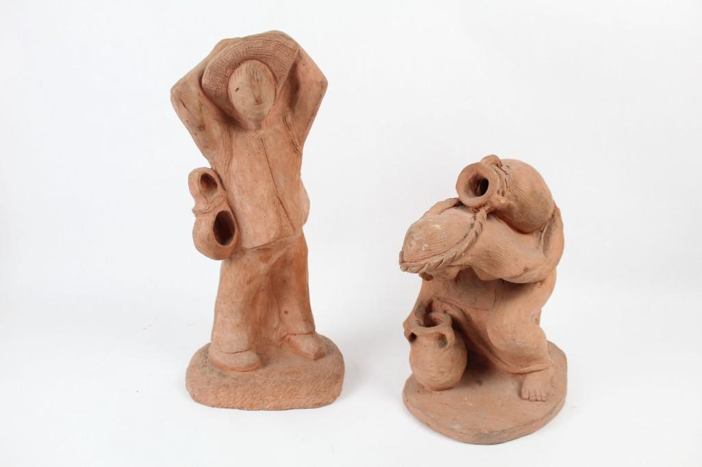 Pair of Two Gatherer Terra Cotta Statues: Pair of Two Gatherer Terra Cotta Statues. Bottom is signed "GMR 56" & "GMR 58". The dimensions of the smaller statue measure 12in H, 6.25in W, and 9in D. The dimensions of the larger statue measure 16